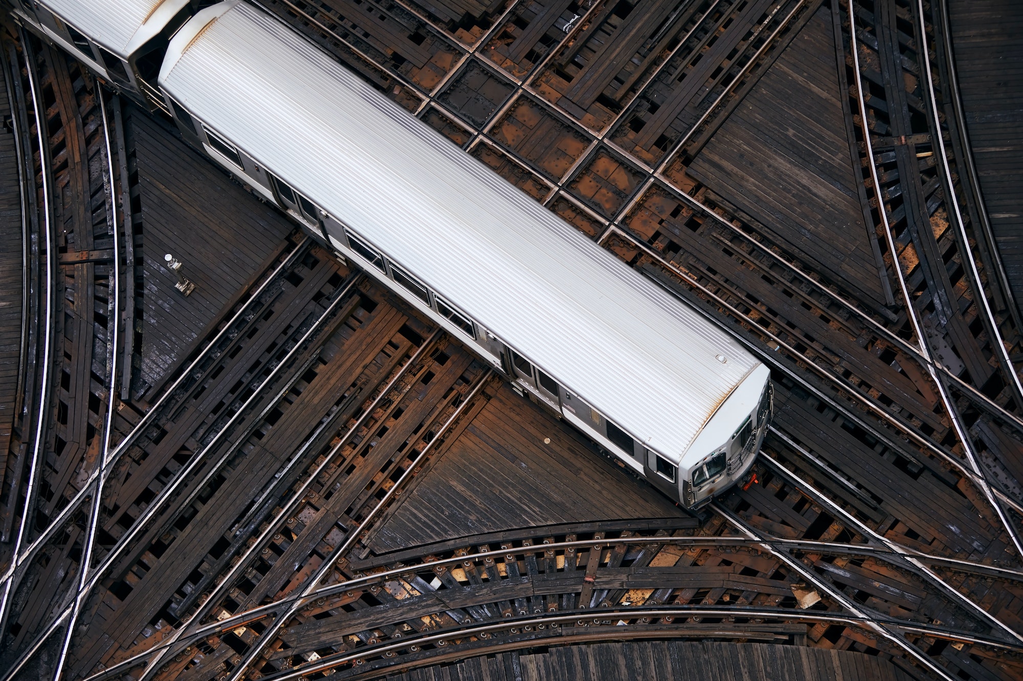 High angle view of passenger train on railroad junction